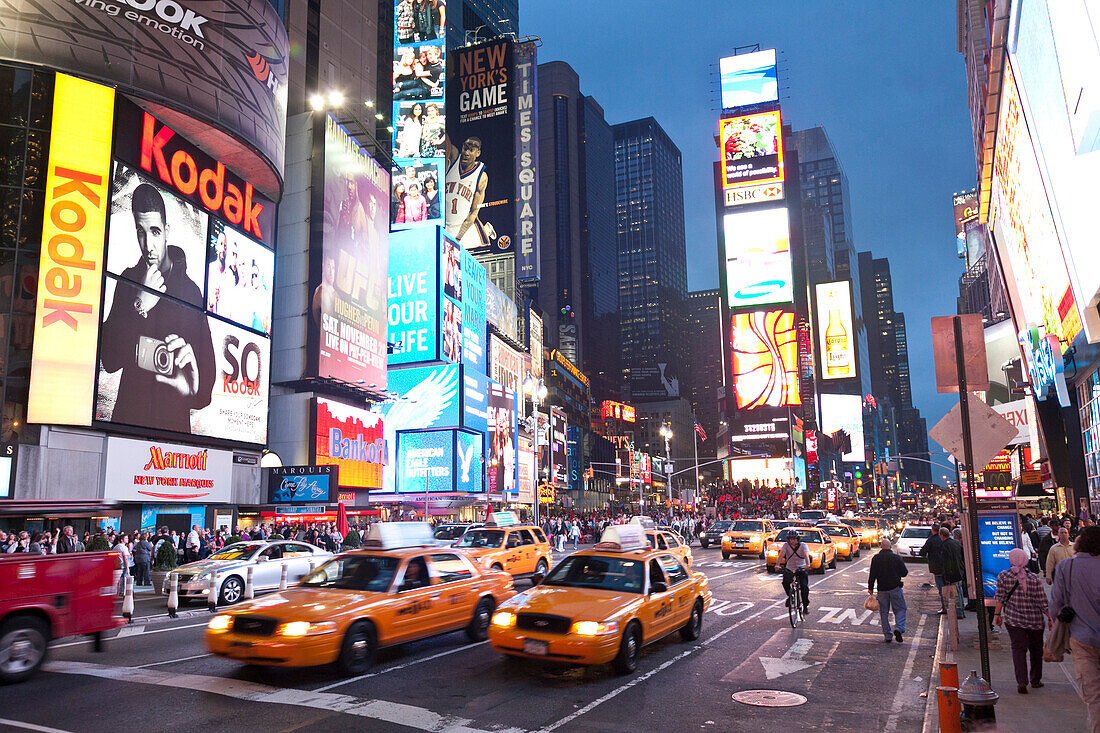 Times Square at night, yellow cabs and Illuminated Advertising, Manhattan, New York City, United States of America, USA