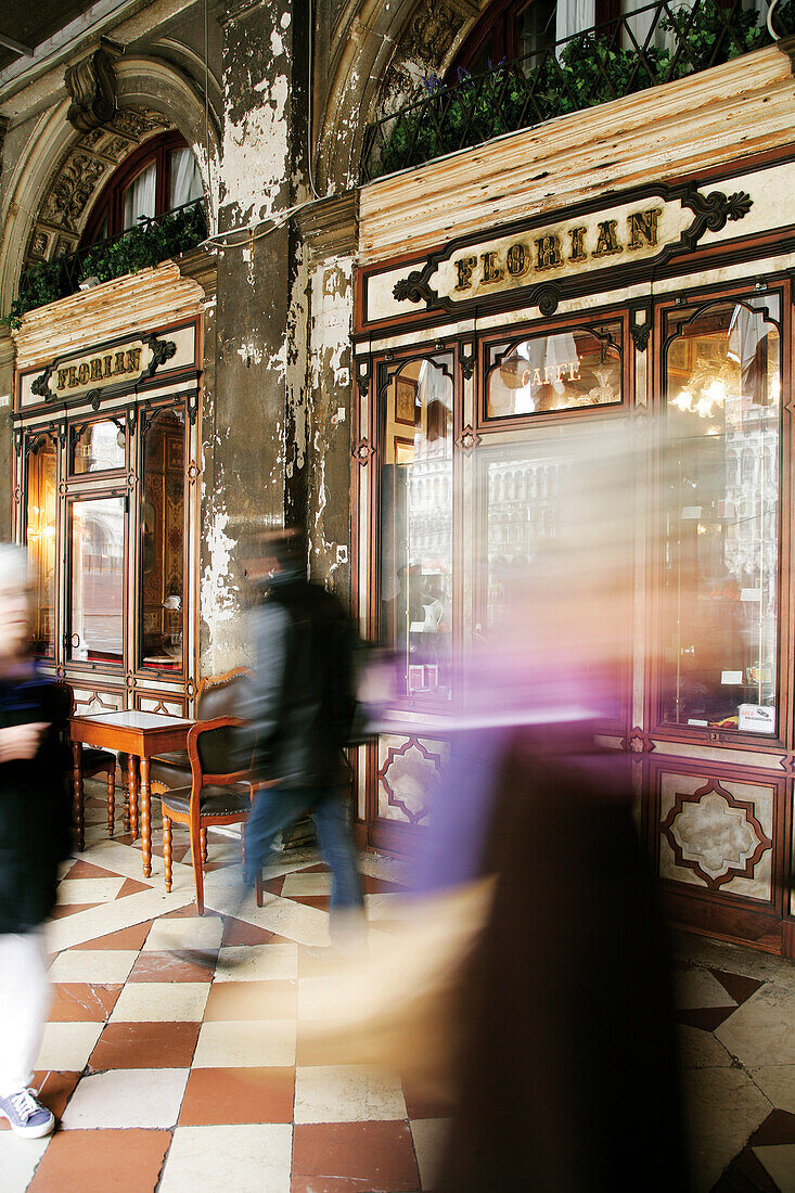 People walking past Cafe Florian, Venice, Italy