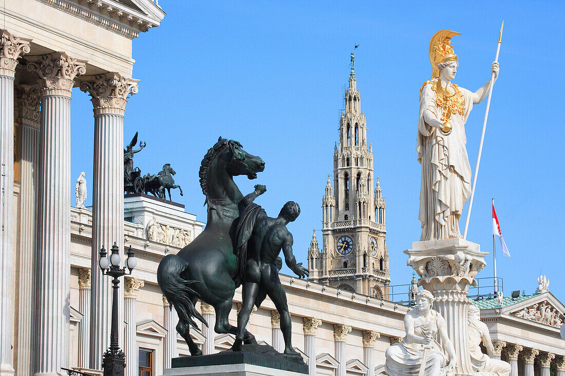 Parliament  with statues and Rathaus - City Hall, Vienna, Austria