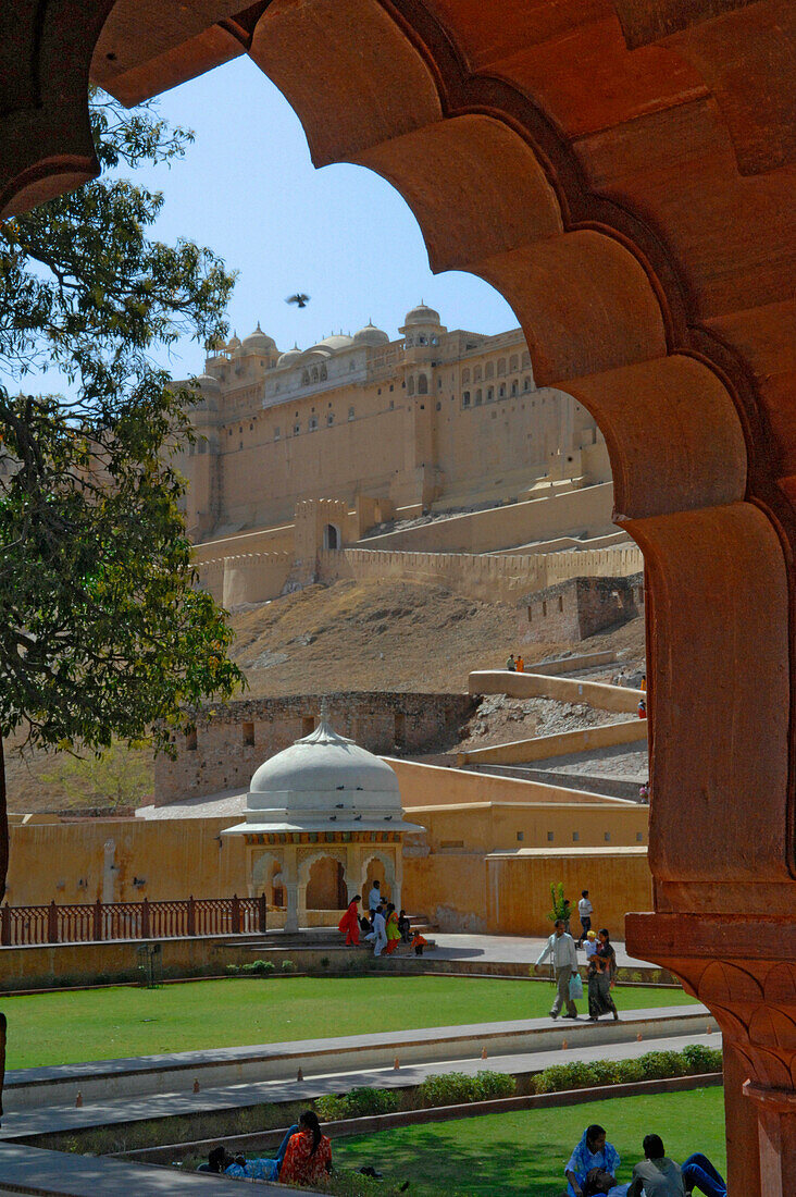 A garden under the walls of Amber Fort seen through arch, Jaipur, Rajasthan, India