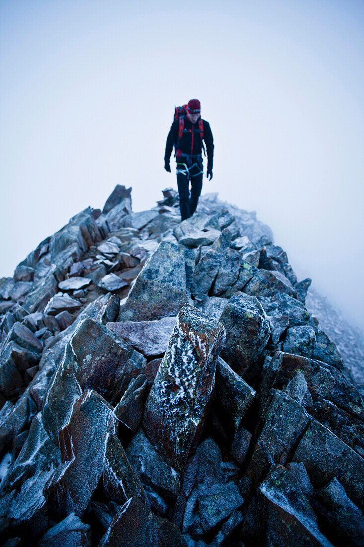 Mountaineer at southeast ridge of Wildspitze, Ötztal Alps, Tyrol, Austria