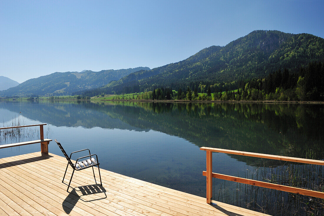 Wooden ponton with chair for bathers, lake Weissensee, Carinthia, Austria, Europe