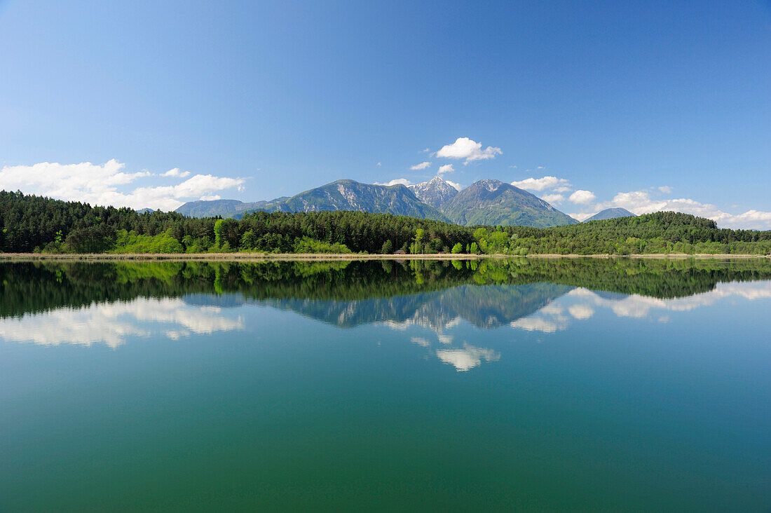 Karawanken range reflecting in lake Turnersee, lake Turnersee, Carinthia, Austria, Europe