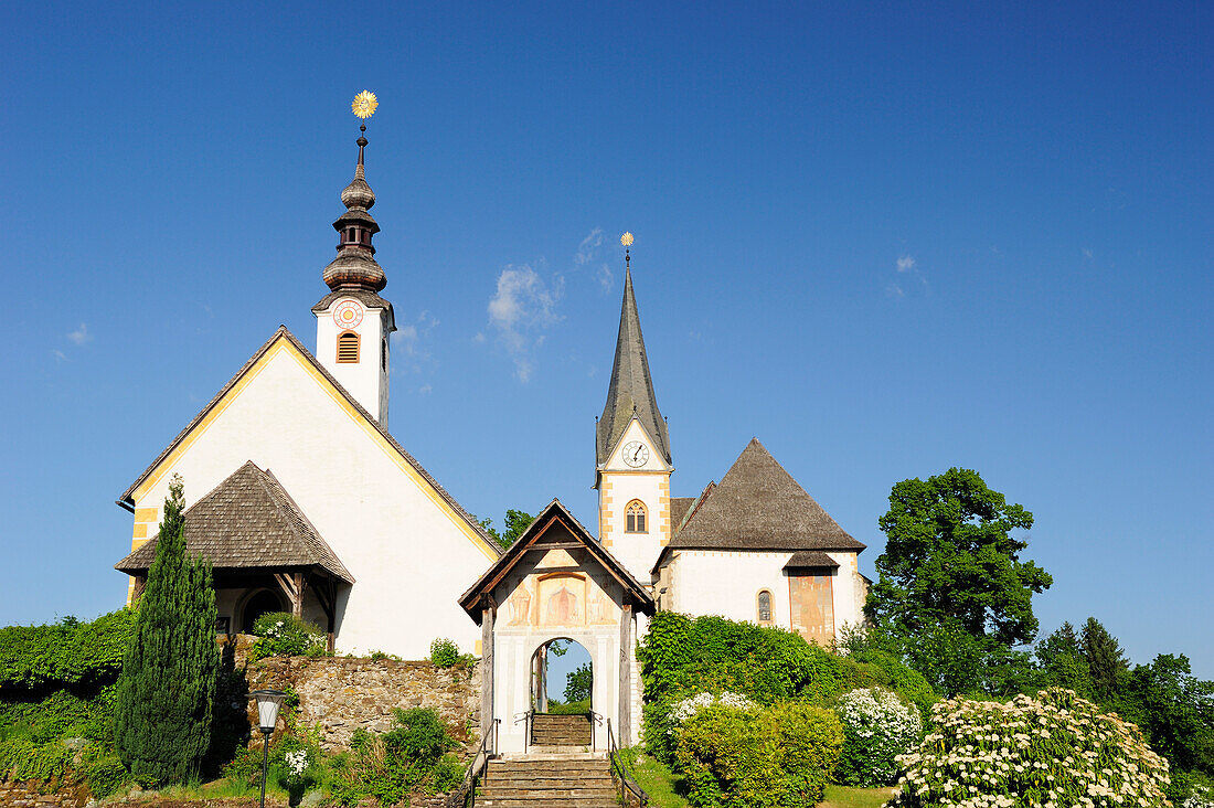 Churches of Maria Woerth under blue sky, Carinthia, Austria, Europe