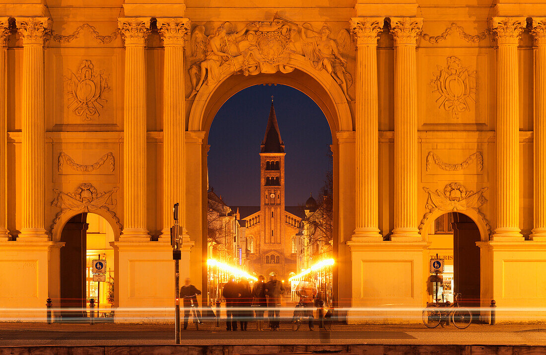 Illuminated Brandenburg Gate and St. Peter and Paul Church at night, Potsdam, Brandenburg, Germany, Europe