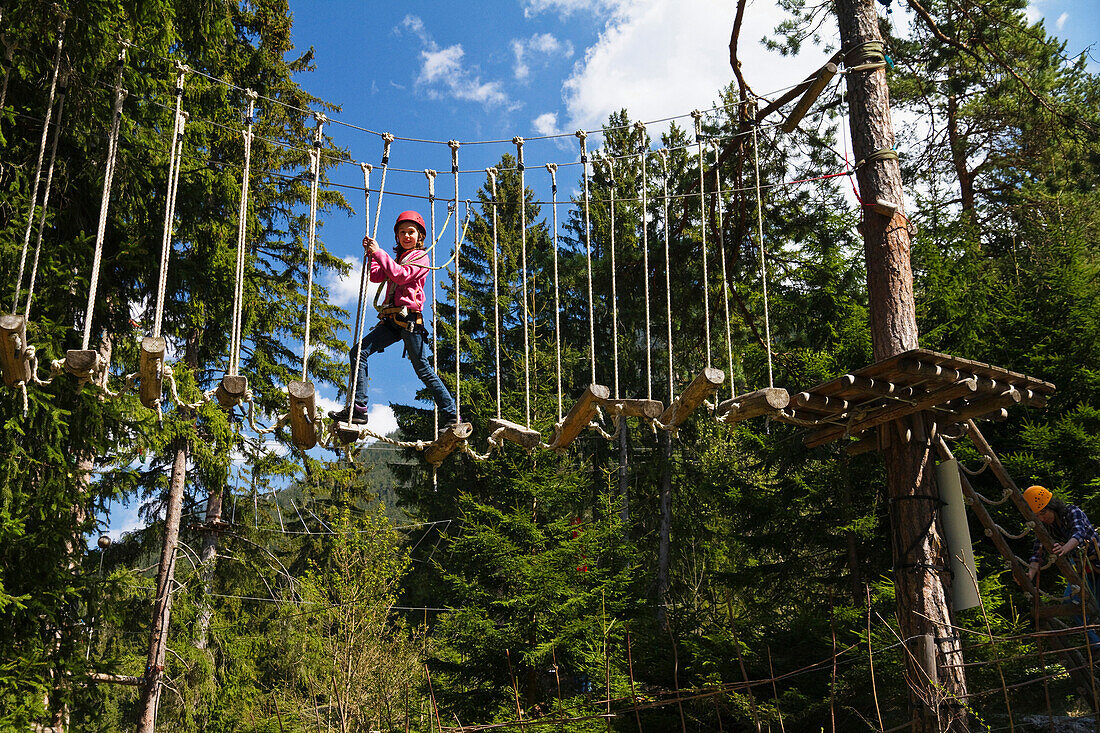 Girl 11 years in ropes course, Garmisch-Partenkirchen, Upper Bavaria, Germany