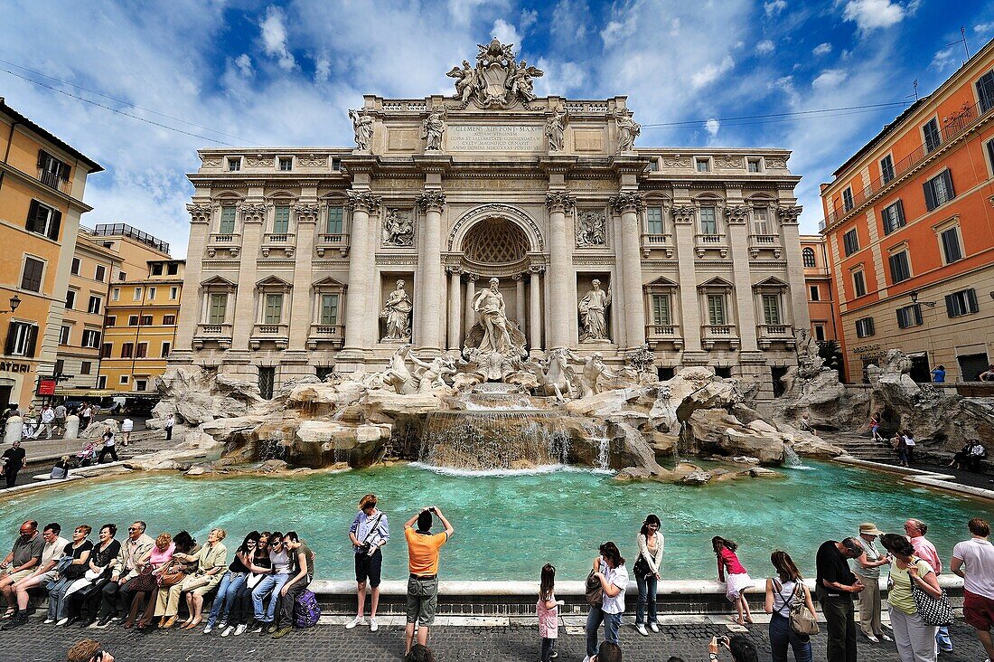 Spectacular view of the Trevi Fountain full of tourists, Rome