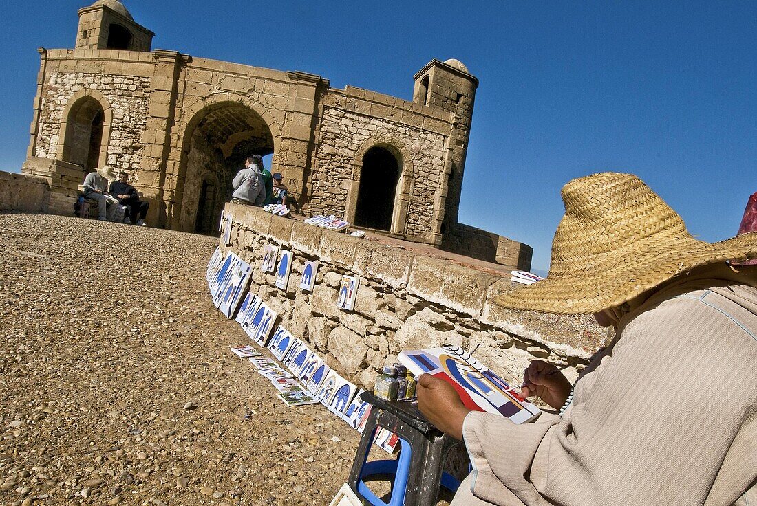 Painter and bastion, Essaouira, Morocco