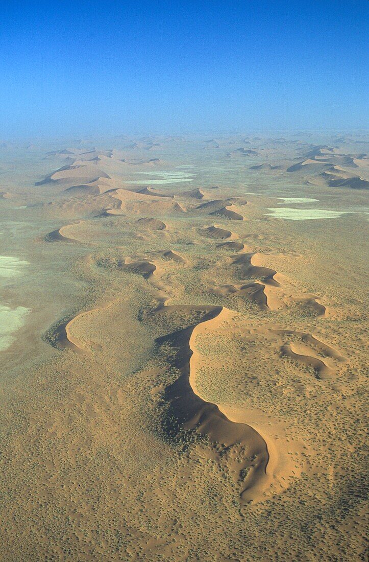 Above, Aerial, Africa, African, Arid, Aridity, Beauty, Blue, Climat, Desert, Desertic, Dunes, Empty, Extreme terrain, Heat, Landscape, Namib, Namibia, National park, Natural, Nature, Naukluft, Orange, Overview, Pattern, Sand, Sky, South, Sunny, Vertical, 