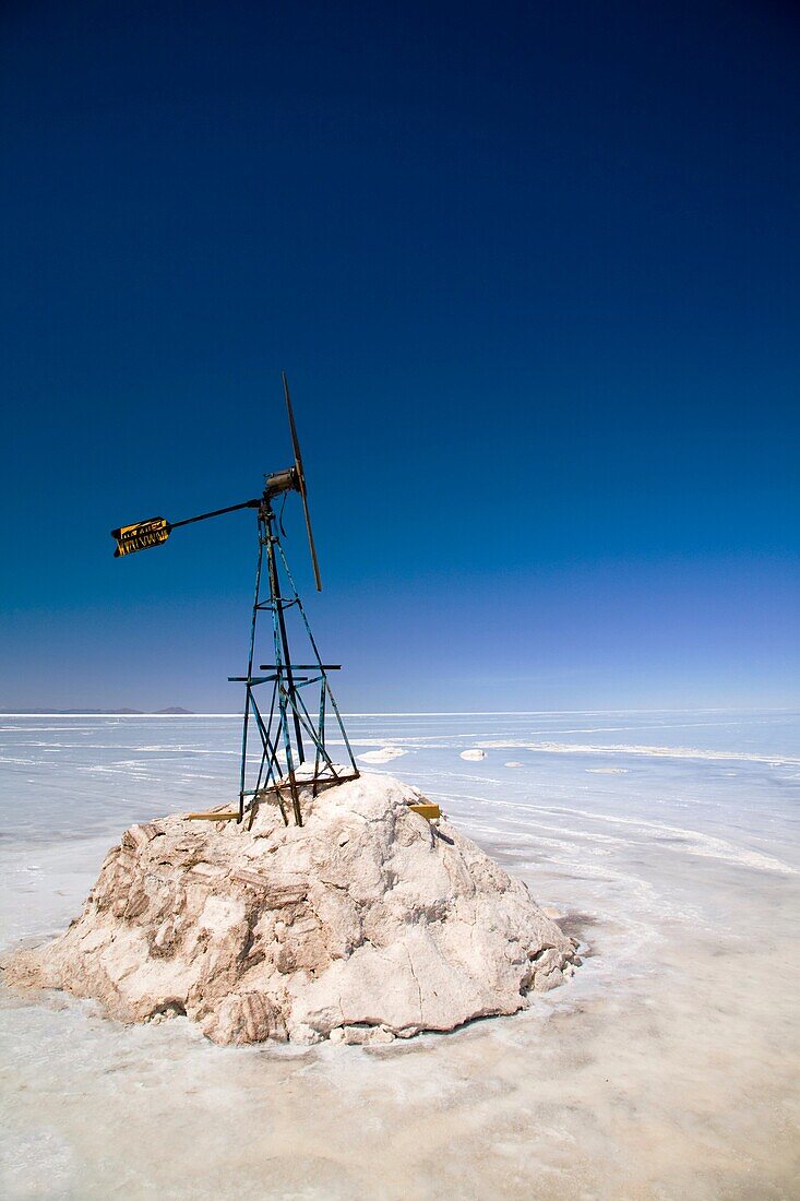 Bolivia, Southern Altiplano, Salar de Uyuni Wind vane situated upon a mound of salt in the Salar de Uyuni salt flat