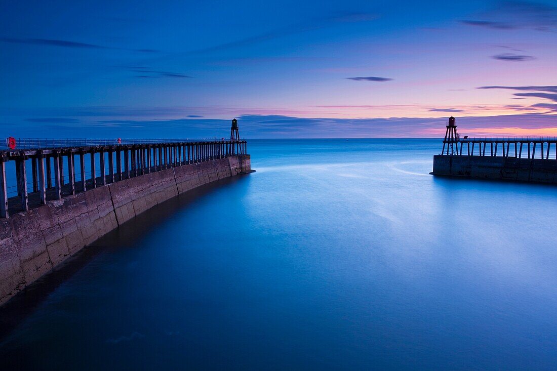 England, North Yorkshire, Whitby The entrance piers of Whitby Harbour at dawn