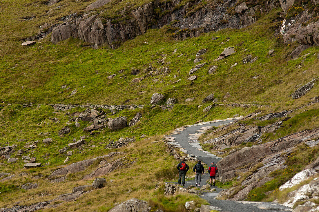 Three hikers on the Miners Track towards Mt. Snowdon, Snowdonia National Park, Wales, UK