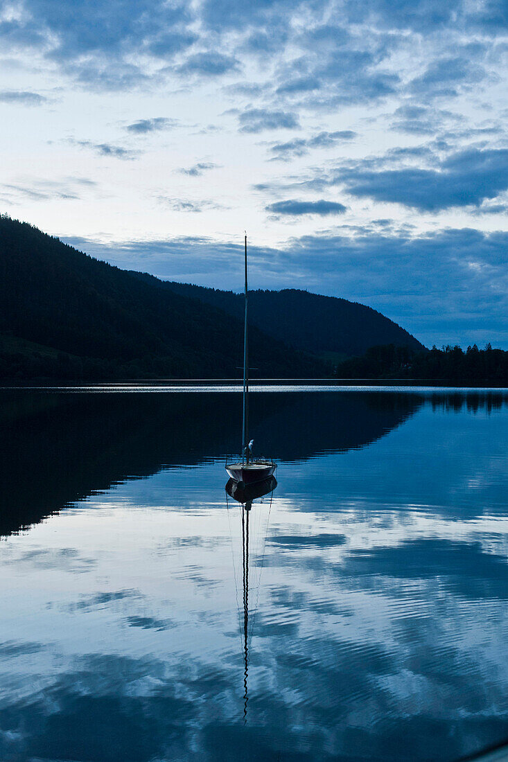 Sailboat on lake Spitzingsee, Bavaria, Germany