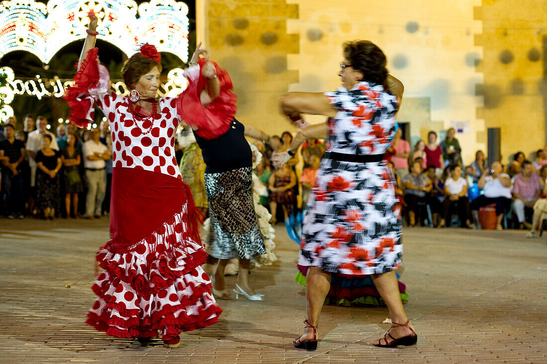 Feria, blurred people dancing, Conil de la Frontera, Andalusia, Spain, Europe