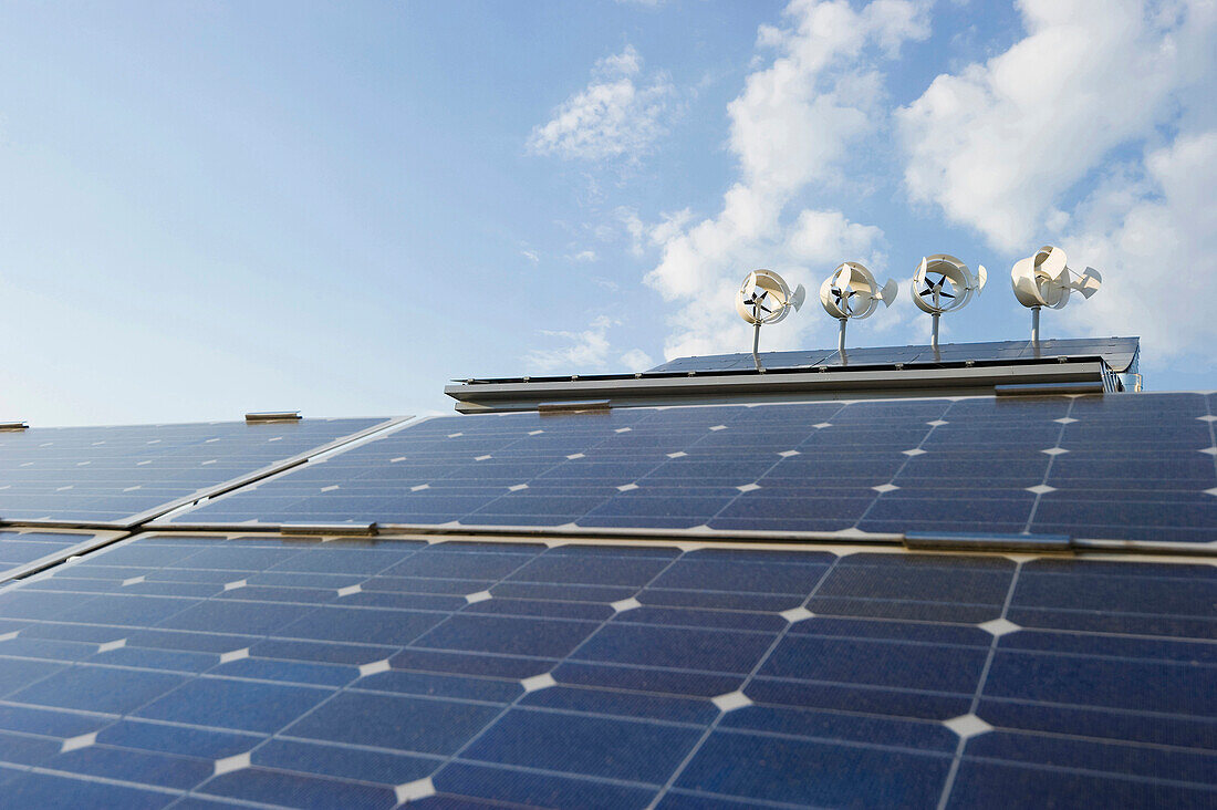 Solar installations and wind turbines on a roof, Freiburg im Breisgau, Baden-Wurttemberg, Germany