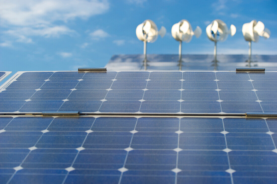 Small wind turbines and solar installations on the roof of Hotel Victoria, Freiburg im Breisgau, Baden-Wuerttemberg, Germany, Europe