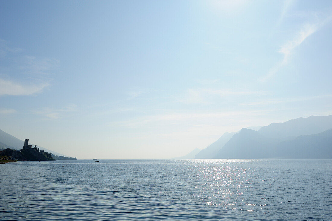 Lake Garda with castel of Malcesine and mountains of Lake Garda in the background, Malcesine, Lake Garda, Veneto, Italy, Europe