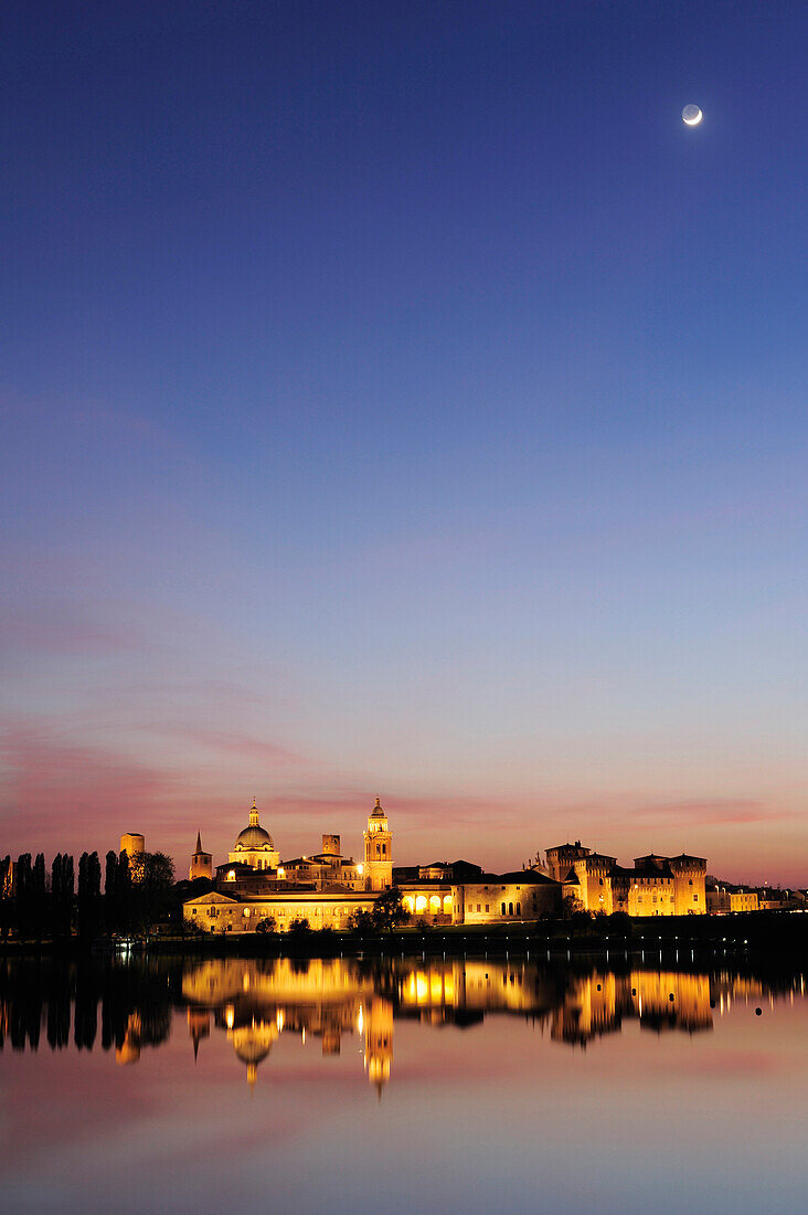 View over Mincio river to old town at night, Mantua, Lombardy, Italy