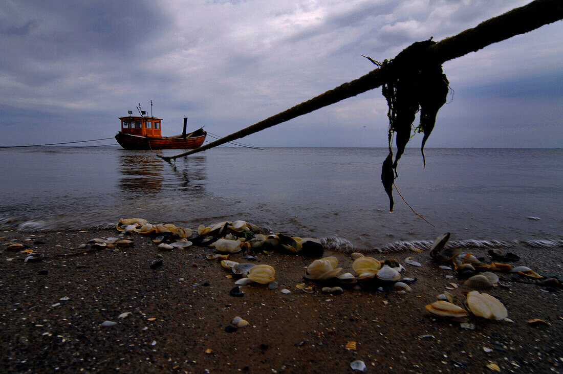 Fishing boat under dark clouds, Ahlbeck, Usedom, Mecklenburg-Western Pomerania, Germany, Europe