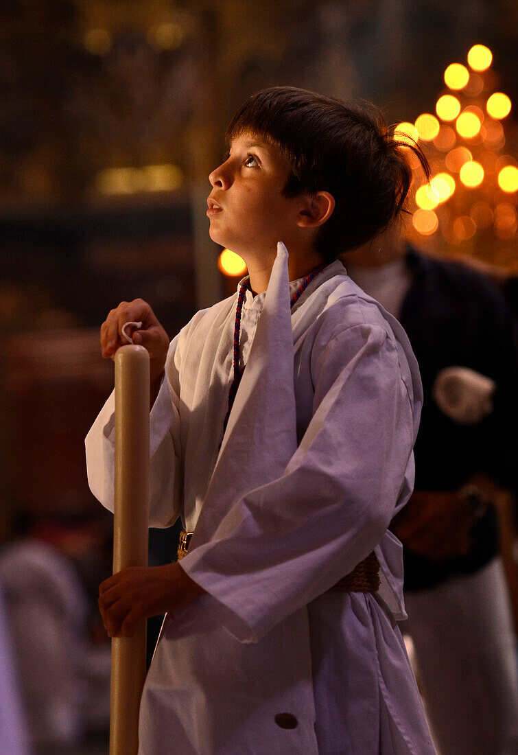 Boy in white cowl at the church El Salvador on Palm Sunday, Brotherhood La Borriquita, Semana Santa, Sevilla, Andalusia, Spain, Europe