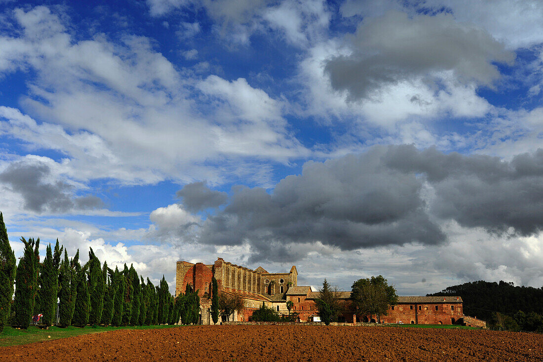 Ruins of the Cistercian abbey Abbazia San Galgano under clouded sky, Tuscany, Italy, Europe