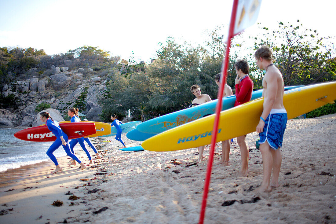 Teen members of the Arcadian Surf Life Saving Club at Alma Bay, eastcoast of Magnetic island, Great Barrier Reef Marine Park, UNESCO World Heritage Site, Queensland, Australia