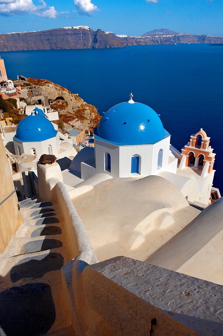 Oia, Ia Santorini - Blue domed Byzantine Orthodax churches, - Greek Cyclades islands .