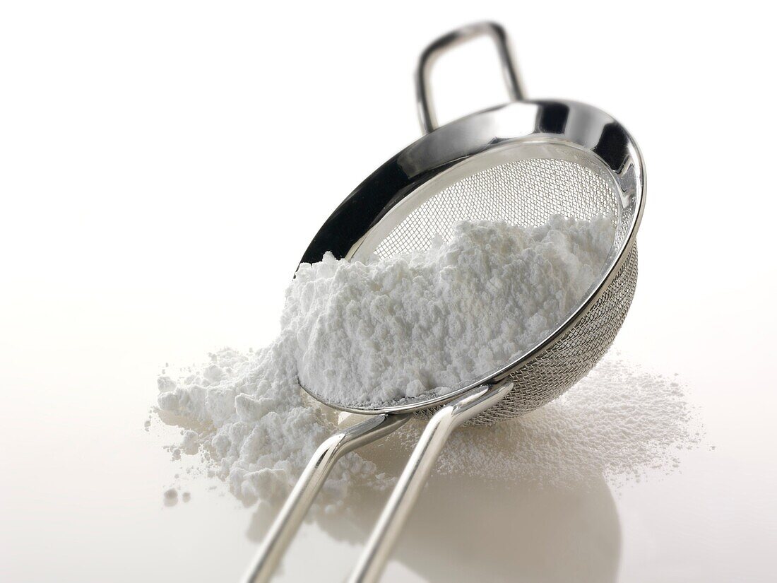 Icing sugar on a sieve