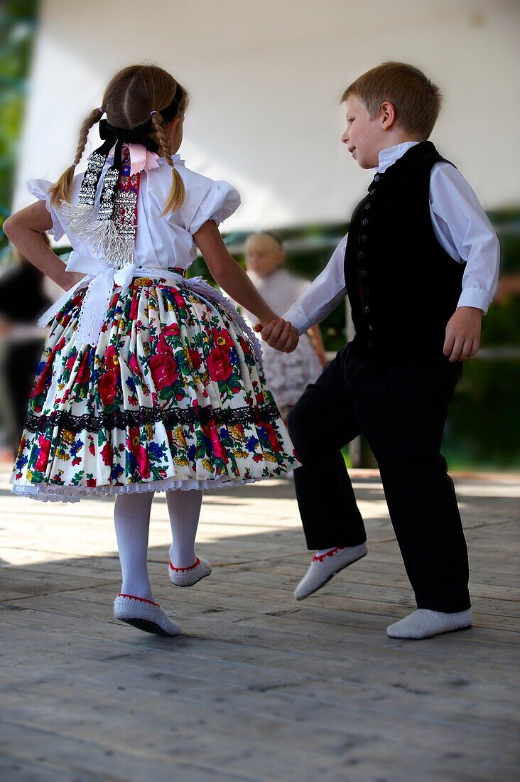 Young Svab children in traditional dress dancing at the wine harvest festival, Hajos Hajós Hungary