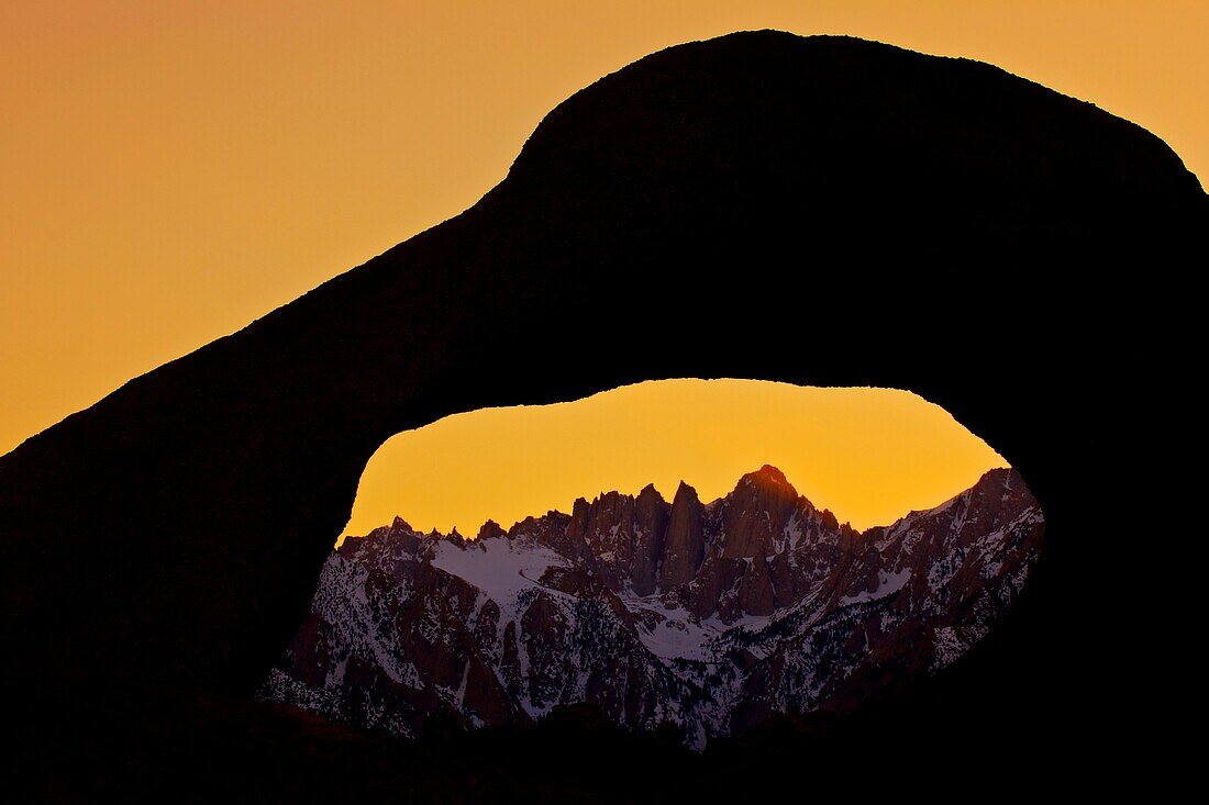 North America, USA, California, Lone Pine Mt Whitney viewed through Mobius Arch in the Alabama Hills