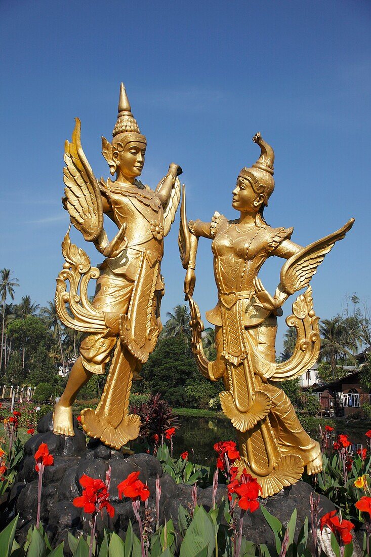 Myanmar, Burma, Yangon, Rangoon, golden statues in a garden