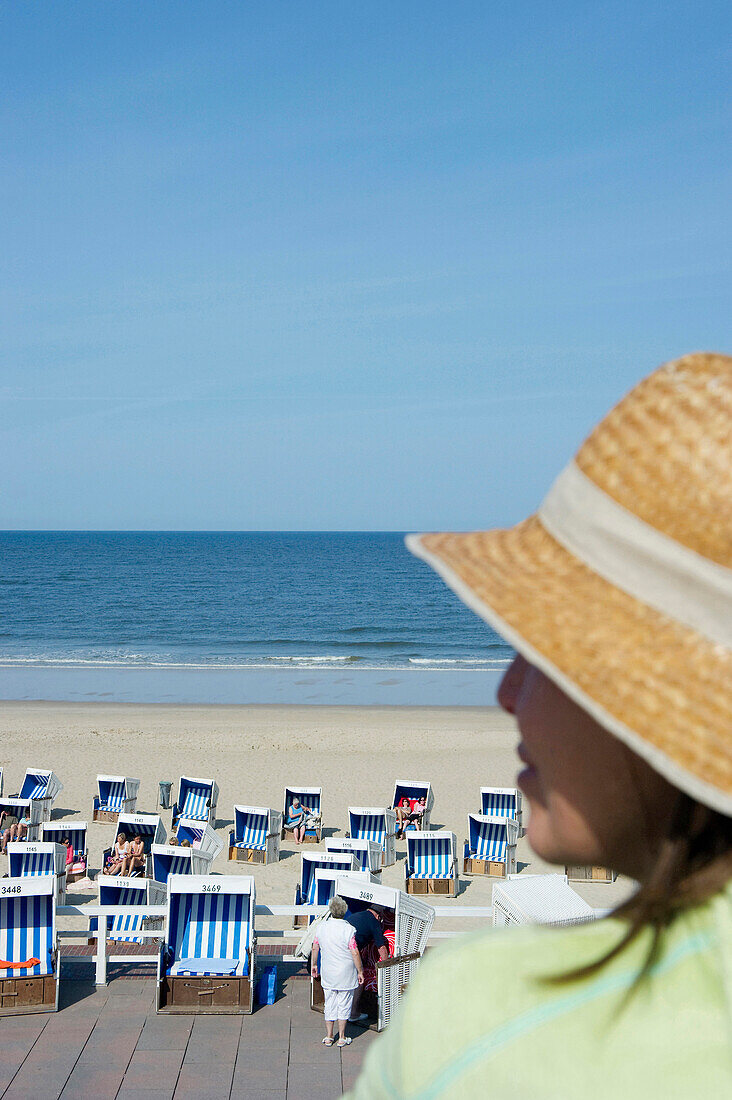 View over boardwalk with beach chairs, Westerland, Sylt island, Schleswig-Holstein, Germany