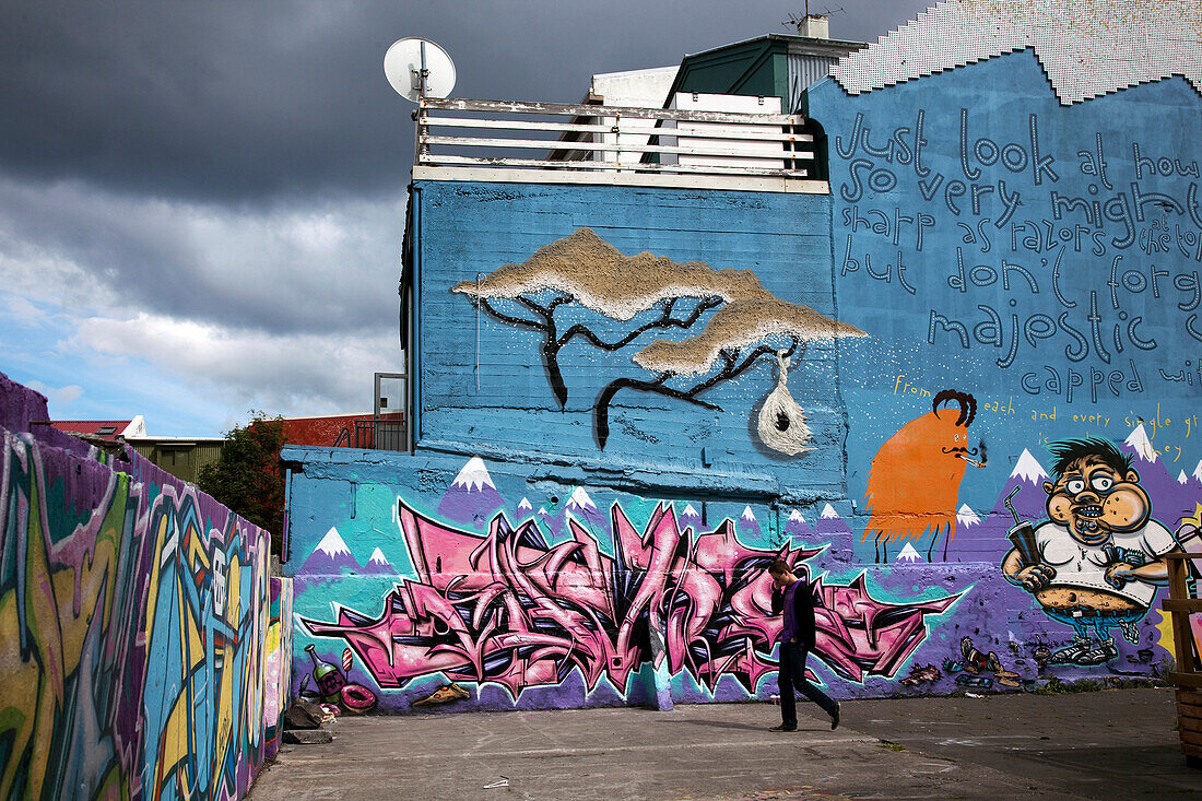 Man in front of Graffiti-Covered Walls in the Capital Reykjavik, Iceland, Europe
