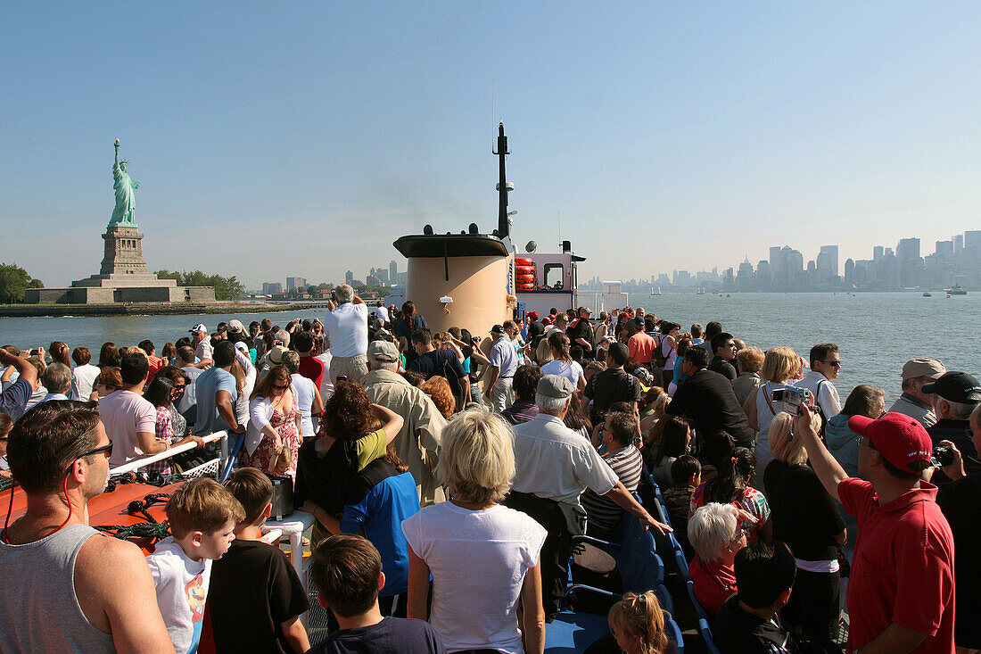 Tourists on a Boat From the Statue Cruises Line Going to the Statue of Liberty, Port of New York City, New York State, United States
