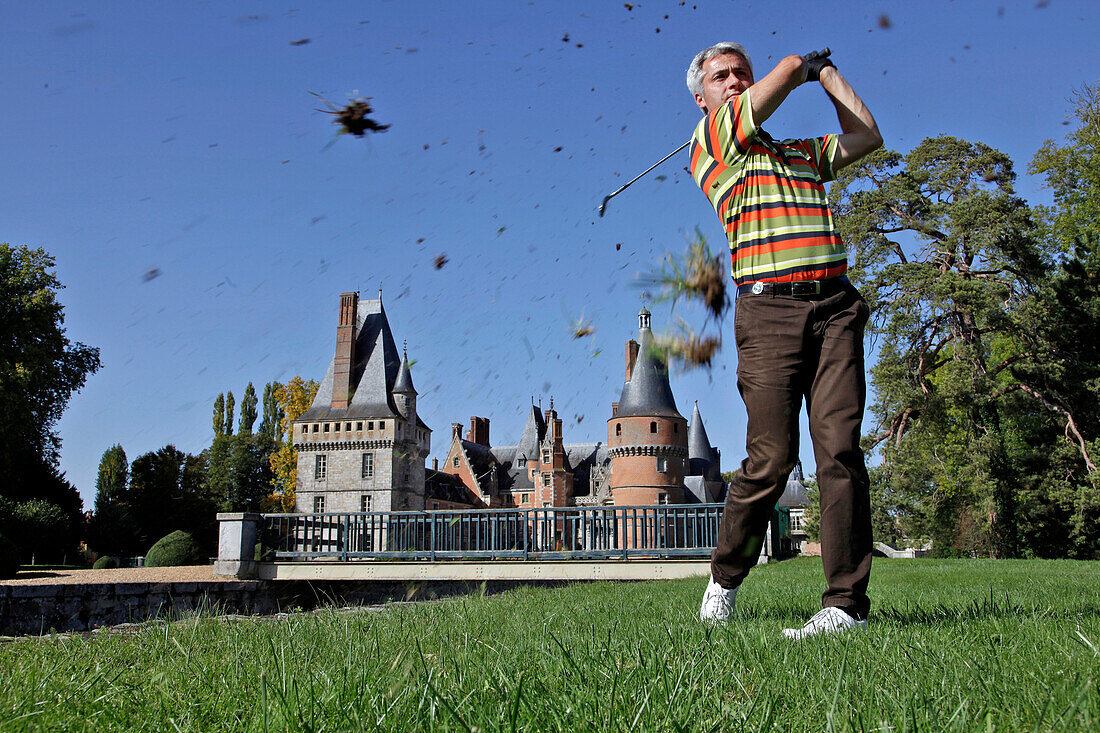 Golfer in front of the Chateau De Maintenon, Eure-Et-Loir (28), France