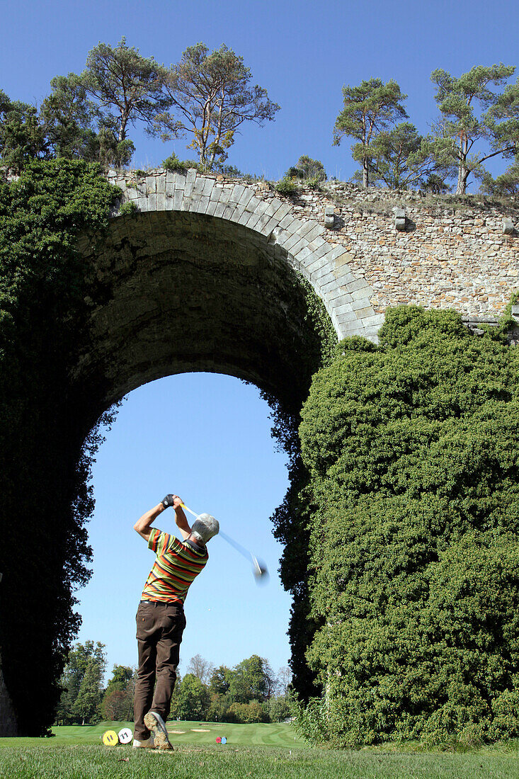 Golfer in front of the Aqueduct of Maintenon, Eure-Et-Loir (28), France