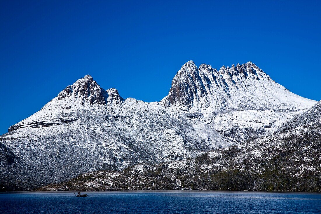 Australia, Tasmania, Cradle Mt - Lake St Clair National Park Fresh cover of snow on Cradle Mountain, viewed from Dove Lake