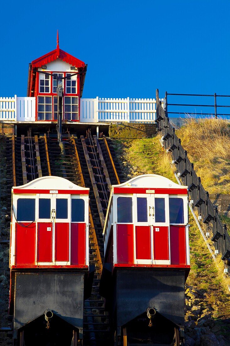 England, Cleveland, Saltburn-by-the-Sea View looking towards the top of the funicular railway, one of the world's oldest water-powered cliff lifts, from the station near the pier