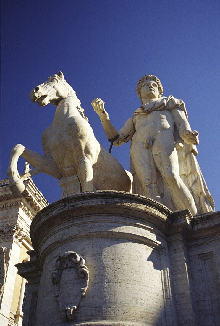 Italy, Lazio, Rome Campidoglio Castor and Pollux statue in the city of Rome, against a blue sky backdrop