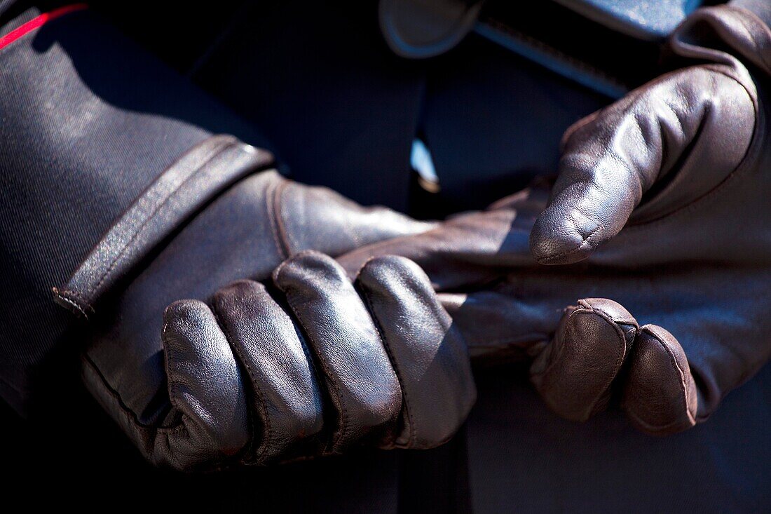 Italy, Lazio, Rome Detail shot of hand and glove belonging to a police officer on the Piazza Quirinale in front of the Presidential Palace