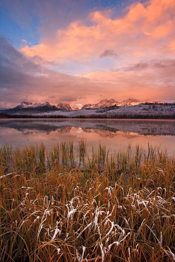 Sawtooth montains sunrise reflection in little red fish lake, Idaho