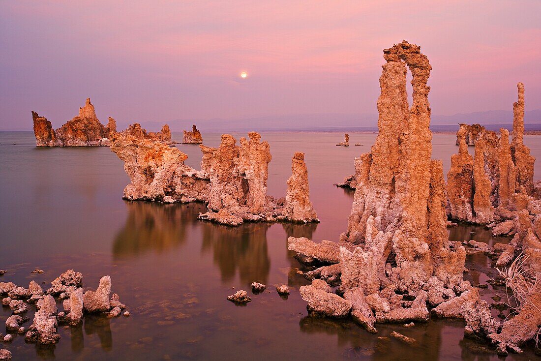 Sunset over Mono Lake tufas with full moon in the background