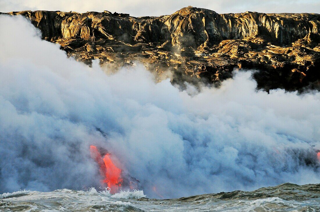 Steam rising off lava flowing into ocean, Kilauea Volcano, Hawaii Islands, United States
