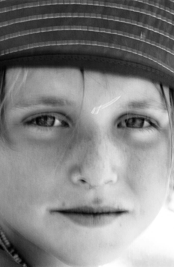 Girl wearing hat, close-up, b&w