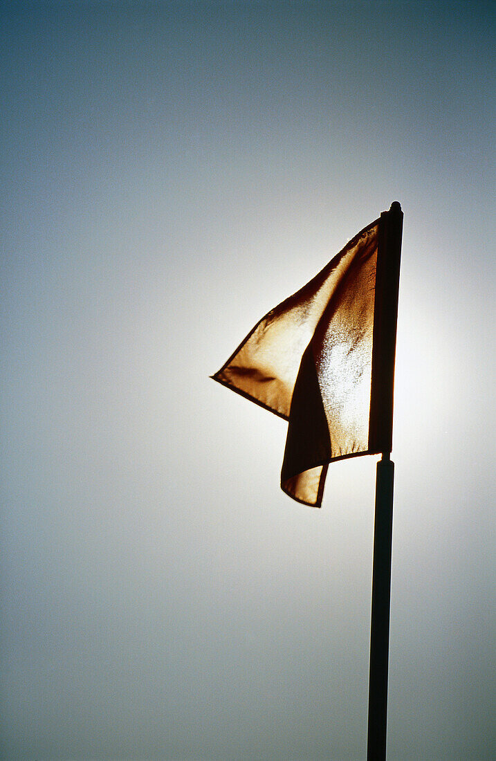 Flag, sun in background