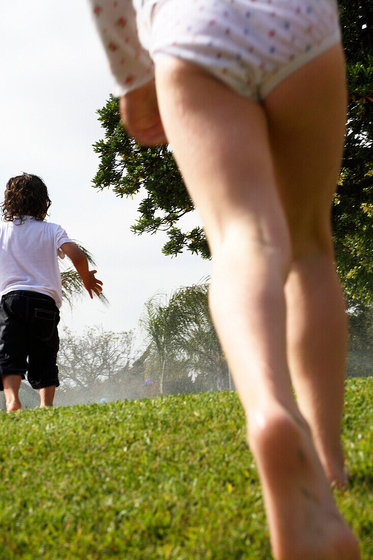 Children Walking on Grass