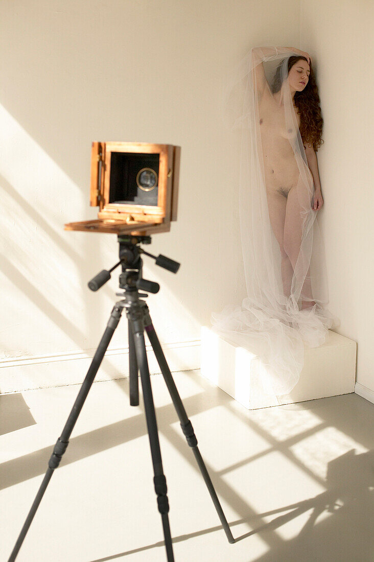 Large Format Camera Pointed at Nude Obscured by Sheer Gauze
