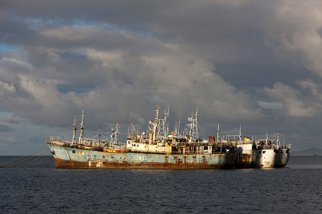 Cargo Boats laying at anchor, Beqa Lagoon, Viti Levu, Fiji