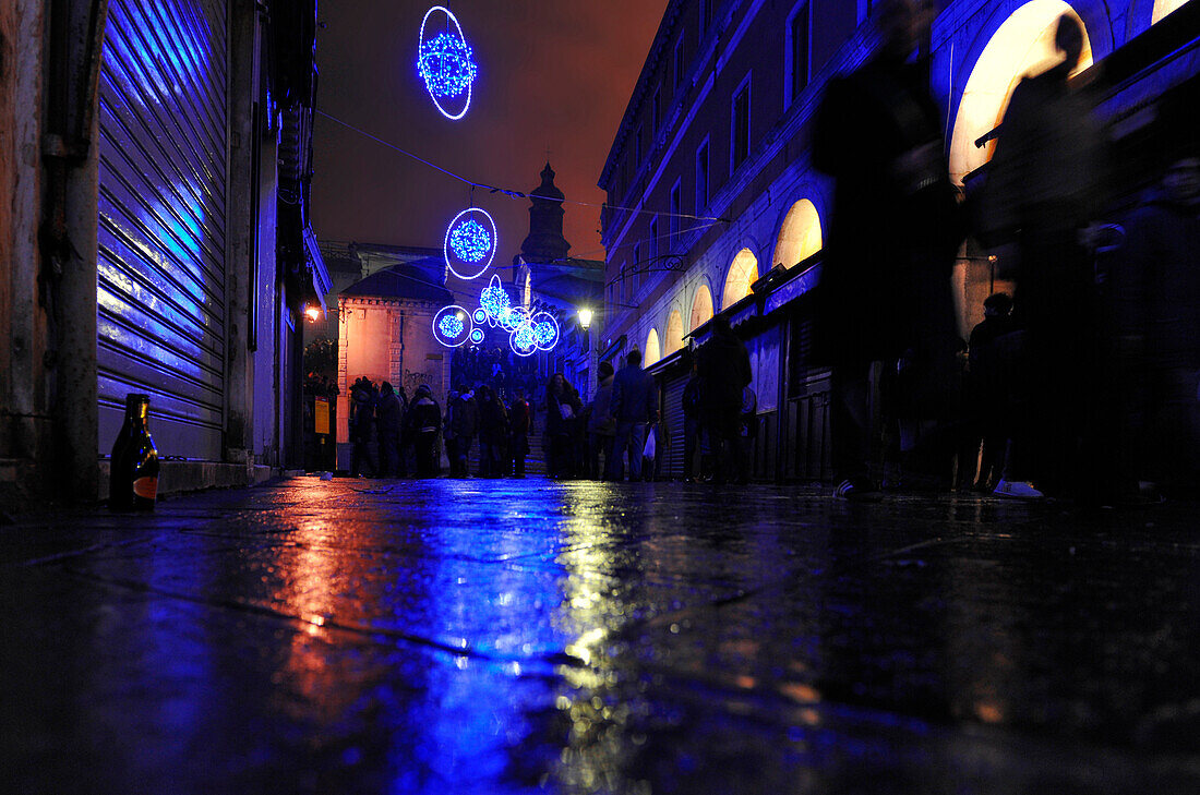 Neon lights in the street at night, New Year's Eve, near the Rialto Bridge, Venice, Italy