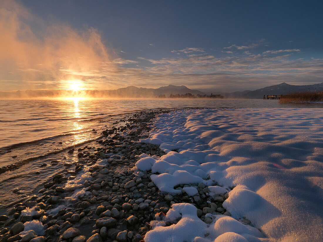 Winter scenery in Gstadt at sunset, view to Fraueninsel, Chiemsee, Bavaria, Germany